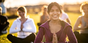 women practise yoga