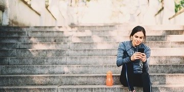 jogger checks mobile